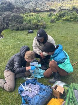 People collecting lake water samples