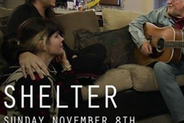Two people facing a man with a guitar with the words "Shelter, Sunday November 8th, 10pm EST/7 pm PST